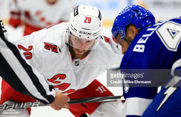 Drew Shore of the Carolina Hurricanes faces off during a preseason game against the Tampa Bay Lightning at Amalie Arena on October 01, 2021 in Tampa,...