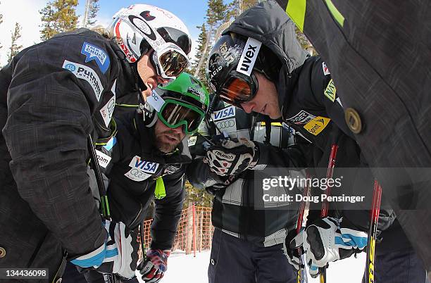 Ski Team members Erik Fisher, Travis Ganong and Andrew Weibrecht listen to a course report downhill training on The Birds of Prey during the Audi FIS...