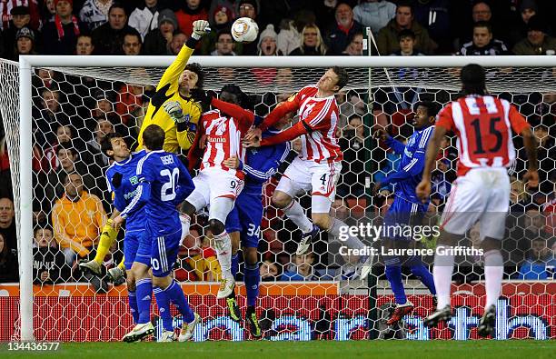 Oleksandr Shovkovskyi of Dynamo Kyiv punches clear under pressure from Kenwyne Jones of Stoke City during the UEFA Europa League Group E match...