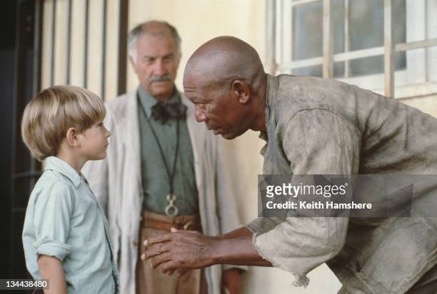 Child actor Guy Witcher as the 7-year-old P.K. And American actor Morgan Freeman as Geel Piet, his boxing mentor, in the film 'The Power of One',...