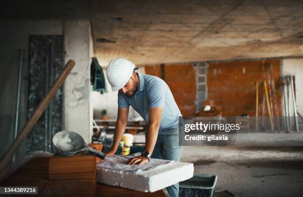 construction engineer supervising building process - property developer stock pictures, royalty-free photos & images