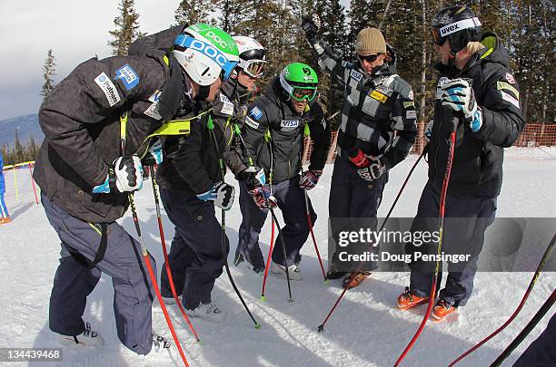 Ski Team members Bryce Bennett Erik Fisher, Travis Ganong, physical therapist Adam Perreault and Andrew Weibrecht listen to a course report from Bode...