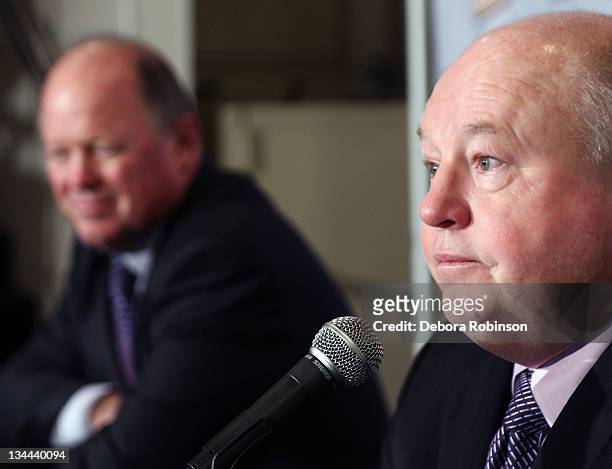 General Manager Bob Murray looks on as newly announced head coach Bruce Boudreau addresses the media after practice at Anaheim Ice on December 1,...