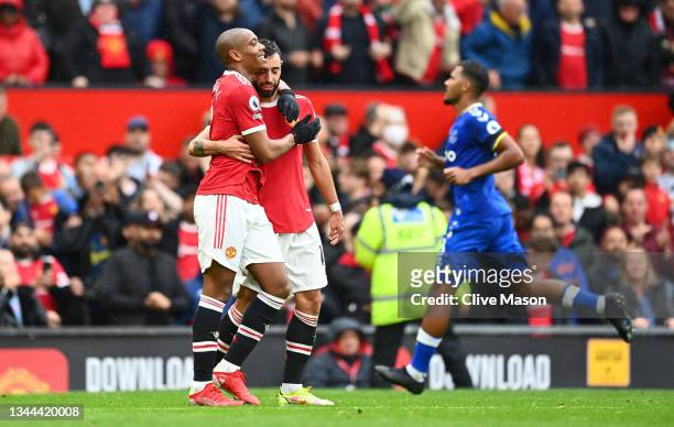 Anthony Martial celebrates with Bruno Fernandes of Manchester United after scoring their team's first goal during the Premier League match between...