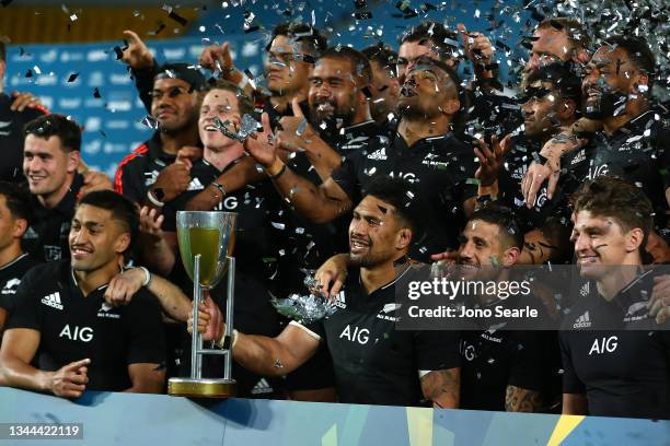 The All Blacks celebrate winning the overall Rugby Championship trophy after the Rugby Championship match between the South Africa Springboks and New...