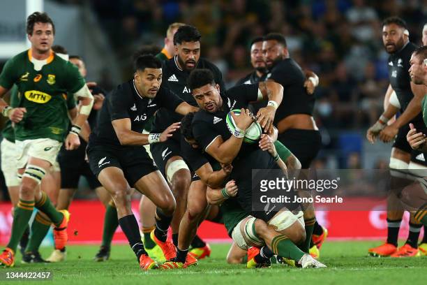 Ardie Savea of the All Blacks is tackled during The Rugby Championship match between the South Africa Springboks and New Zealand All Blacks at Cbus...