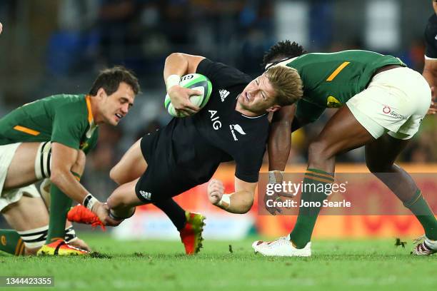 Jordie Barrett of the All Blacks is tackled during The Rugby Championship match between the South Africa Springboks and New Zealand All Blacks at...