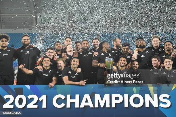 Ardie Savea of the All Blacks and team mates pose with the Rugby Championship trophy following The Rugby Championship match between the South Africa...
