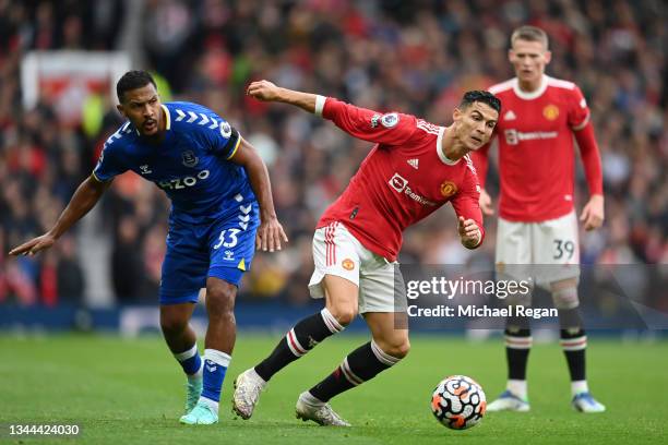 Cristiano Ronaldo of Manchester United battles for possession with Jose Salomon Rondon of Everton during the Premier League match between Manchester...