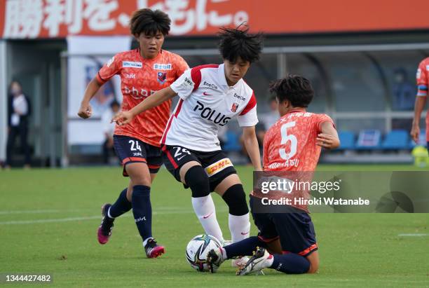 Mei Shimada of Urawa Reds Ladies and Ruka Norimatsu of Omiya Ardija Ventus compete for the ball during the WE League match between Omiya Ardija...