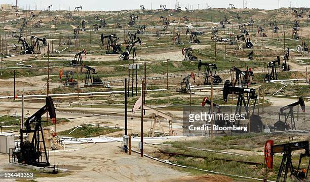 Oil pumps stand at the Chevron Corp. Kern River oil field in Bakersfield, California, U.S., on Tuesday, March 29, 2011. While most of the oil has...