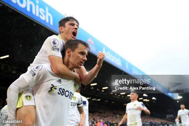 Diego Llorente of Leeds United celebrates with teammate Daniel James after scoring their side's first goal during the Premier League match between...