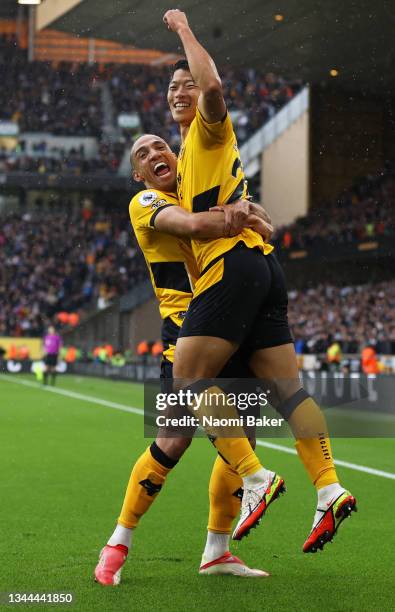 Hwang Hee-chan celebrates with Marcal of Wolverhampton Wanderers after scoring their team's second goal during the Premier League match between...