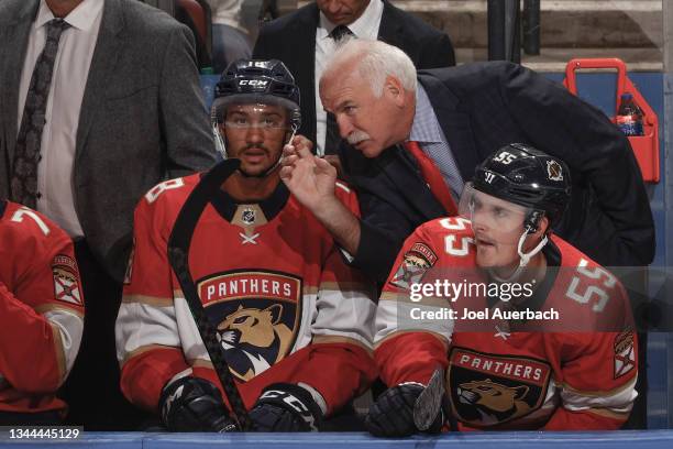 Florida Panthers Head coach Joel Quenneville talks to Servon Noel of the Florida Panthers during third period action against the Dallas Stars during...