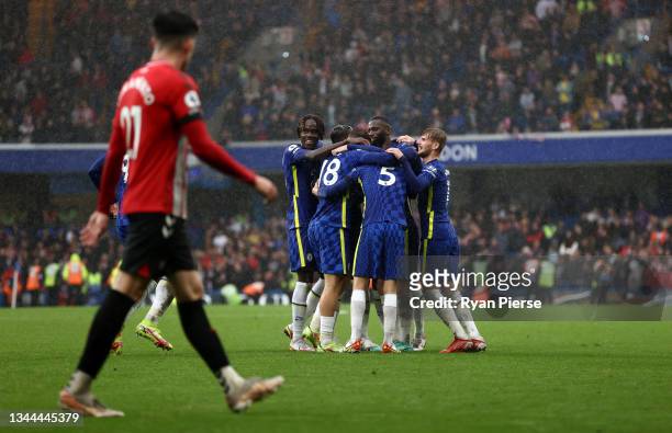 Ben Chilwell celebrates with teammates Trevoh Chalobah, Antonio Ruediger, Timo Werner, Jorginho and Ross Barkley after scoring their team's third...