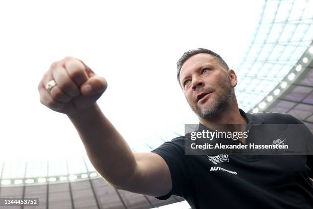 Pal Dardai, head coach of Berlin bumps fists during the Bundesliga match between Hertha BSC and Sport-Club Freiburg at Olympiastadion on October 02,...