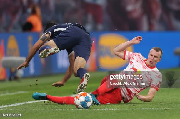 Lukas Klostermann of Leipzig challenges Gerrit Holtmann of Bochum during the Bundesliga match between RB Leipzig and VfL Bochum at Red Bull Arena on...