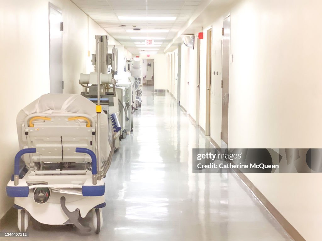 Hospital hallway corridor lined with medical equipment