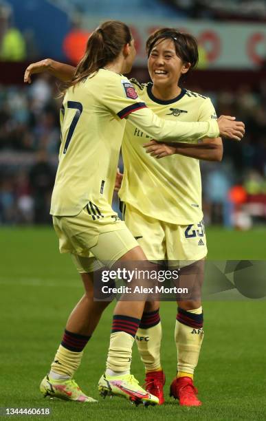 Mana Iwabuchi celebrates with Tobin Heath of Arsenal after scoring their team's second goal during the Barclays FA Women's Super League match between...