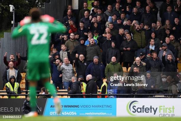 Image contains profanity) Fans of Port Vale react as Lawrence Vigouroux of Leyton Orient celebrates their side's second goal scored by Tom James...