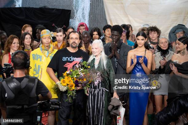 Designer Vivienne Westwood acknowledges the audience with Andreas Kronthaler during the Vivienne Westwood Womenswear Spring/Summer 2022 show as part...