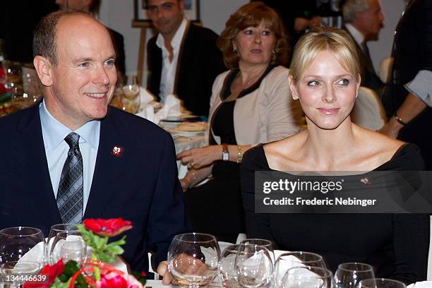 Prince Albert II of Monaco and Princess Charlene of Monaco attend the Fight Aids Monaco Gala And Auction 2011 on December 1, 2011 in Monaco.