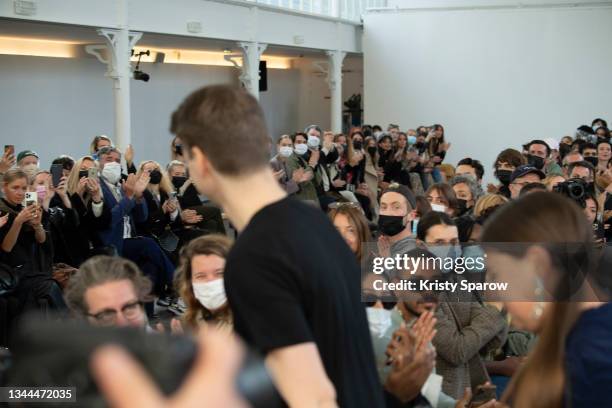 Designers Balthazar Delepierre and Ester Manas acknowledge the audience during the Ester Manas Womenswear Spring/Summer 2022 show as part of Paris...