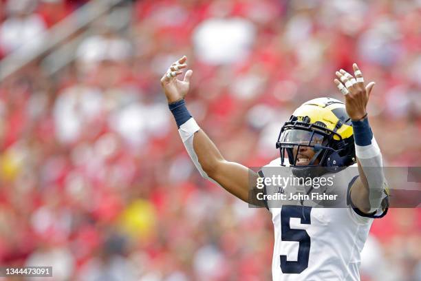 Turner of the Michigan Wolverines reacts toward the bench after a Michigan interception in the fourth quarter against the Wisconsin Badgers at Camp...
