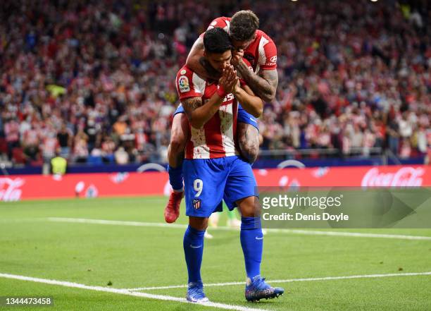 Luis Suarez of Atletico Madrid celebrates with Rodrigo De Paul after scoring their team's second goal during the La Liga Santander match between Club...