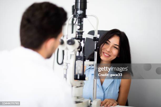 eye test on ophthalmic refractometer - eye color stock pictures, royalty-free photos & images