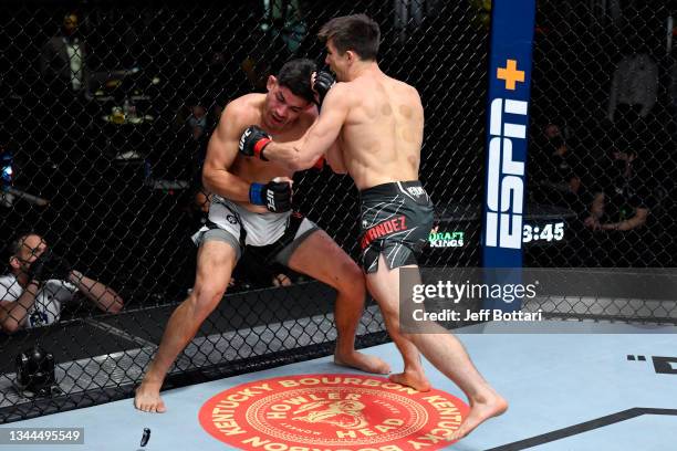 Alexander Hernandez punches Mike Breeden in their lightweight bout during the UFC Fight Night event at UFC APEX on October 02, 2021 in Las Vegas,...