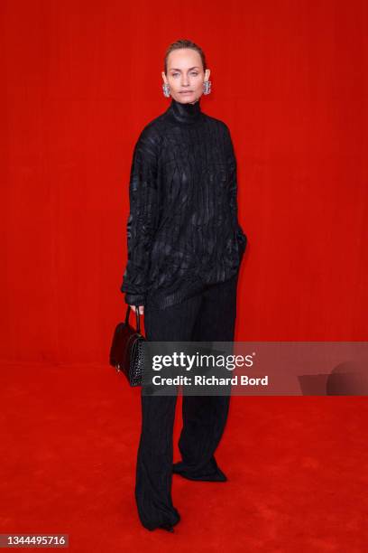 Amber Valletta poses on the runway during the Balenciaga Womenswear Spring/Summer 2022 show as part of Paris Fashion Week at Theatre Du Chatelet on...