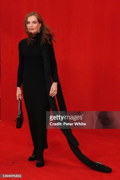 Isabelle Huppert poses on the runway during the Balenciaga Womenswear Spring/Summer 2022 show as part of Paris Fashion Week at Theatre Du Chatelet on...