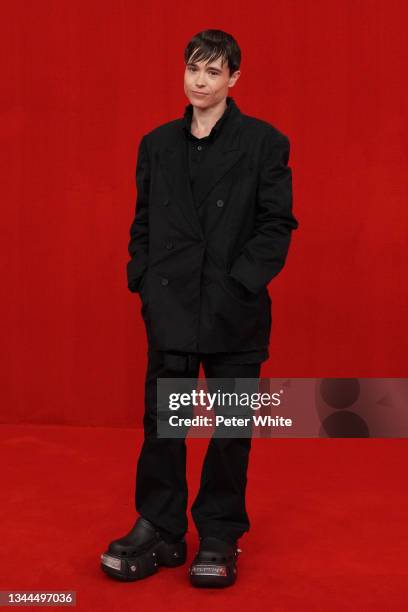 Elliot Page poses on the runway during the Balenciaga Womenswear Spring/Summer 2022 show as part of Paris Fashion Week at Theatre Du Chatelet on...