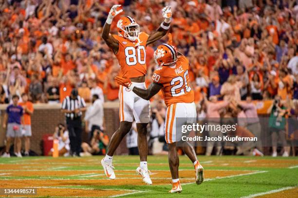 Wide receiver Beaux Collins of the Clemson Tigers celebrates with running back Kobe Pace after a touchdown during the first quarter during their game...