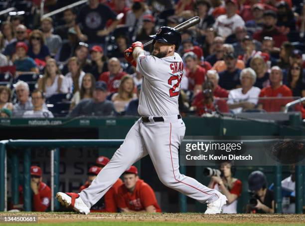 Travis Shaw of the Boston Red Sox connects for a RBI single against the Washington Nationals in the ninth inning at Nationals Park on October 02,...