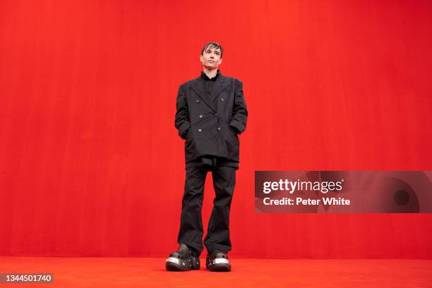 Elliot Page poses on the runway during the Balenciaga Womenswear Spring/Summer 2022 show as part of Paris Fashion Week at Theatre Du Chatelet on...