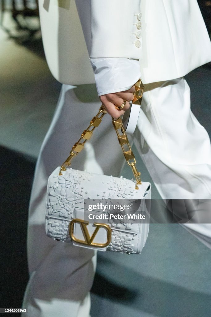 A model, bag detail, walks the runway during the Valentino Womenswear  News Photo - Getty Images