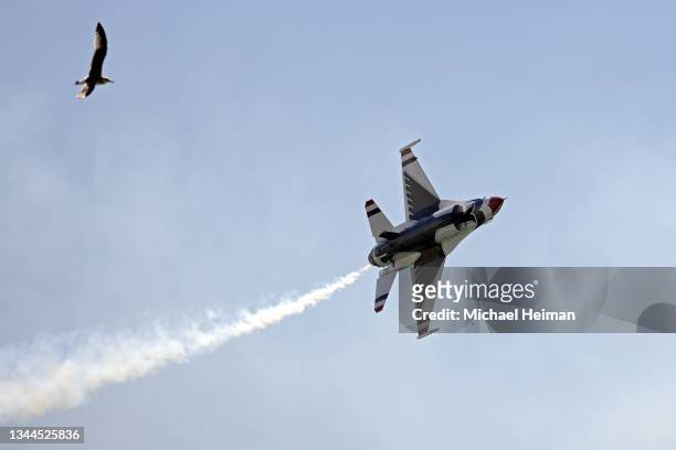 The United States Air Force Thunderbirds fly over the Huntington Beach Pier during the Pacific Airshow on October 01, 2021 in Huntington Beach,...