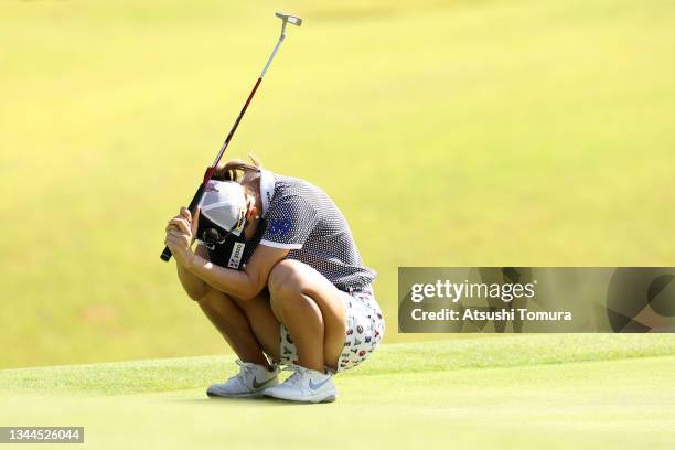 Momoko Ueda of Japan reacts after a putt on the 6th green during the third round of the 54th Japan Women's Open Golf Championship at Karasuyamajo...