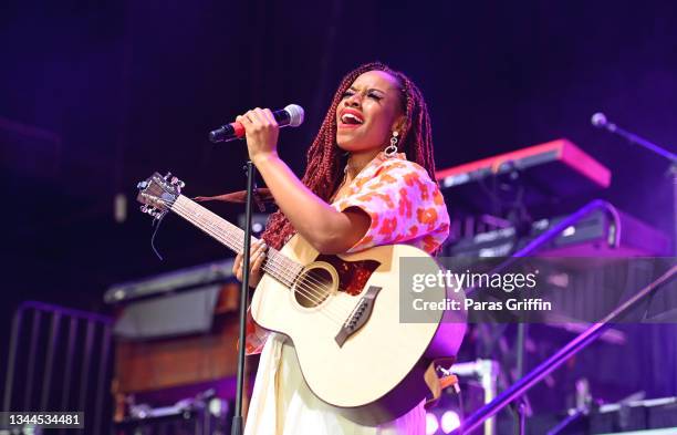 Singer DOE performs onstage during 2021 Praise In The Park at Cellairis Amphitheatre at Lakewood on October 02, 2021 in Atlanta, Georgia.