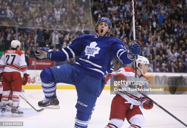 Josh Leivo of the Toronto Maple Leafs celebrates as he scores his first career NHL goal during NHL game action against the Carolina Hurricanes at Air...