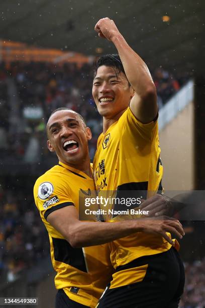 Hwang Hee-chan celebrates with Marcal of Wolverhampton Wanderers after scoring their team's second goal during the Premier League match between...