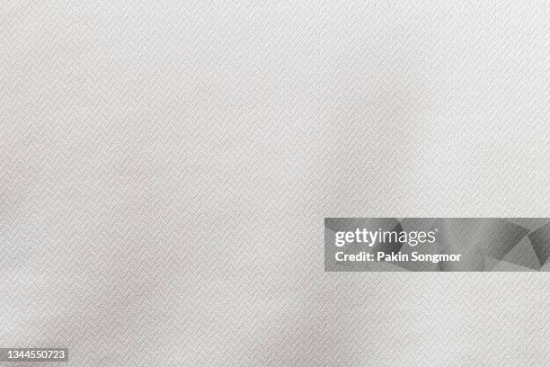 white color sports clothing fabric football shirt jersey texture and textile background. - white shirt template stock pictures, royalty-free photos & images