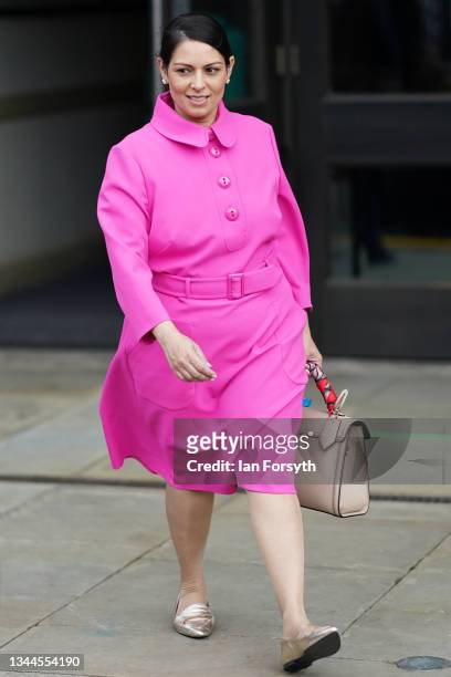 British Home Secretary Priti Patel leaves the Midland Hotel on day one of the Conservative Party Conference on October 03, 2021 in Manchester,...
