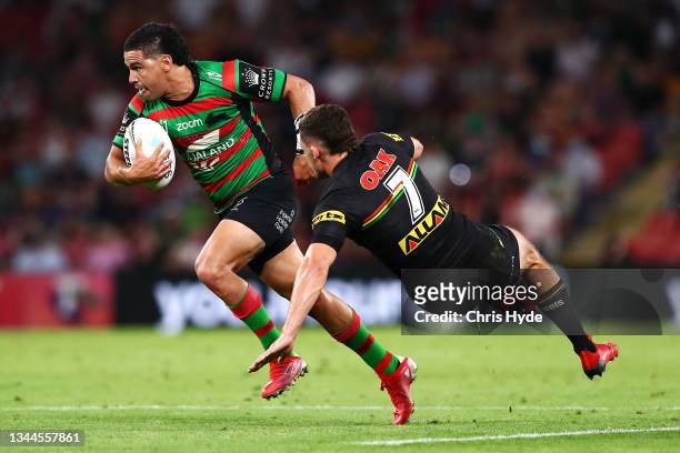 Cody Walker of the Rabbitohs beats the tackle of Nathan Cleary of the Panthers on his way to score a try during the 2021 NRL Grand Final match...