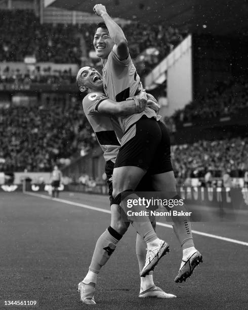 Hwang Hee-chan celebrates with Marcal of Wolverhampton Wanderers after scoring their team's second goal during the Premier League match between...