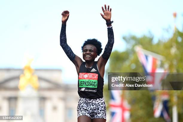 Joyciline Jepkosgei of Kenya celebrates winning the Women's Elite Race during the 2021 Virgin Money London Marathon at Tower Bridge on October 03,...