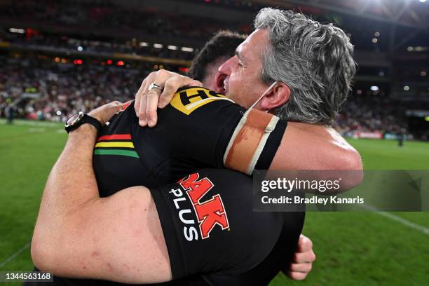 Nathan Cleary of the Panthers hugs his father and coach Ivan Cleary after winning the 2021 NRL Grand Final match between the Penrith Panthers and the...