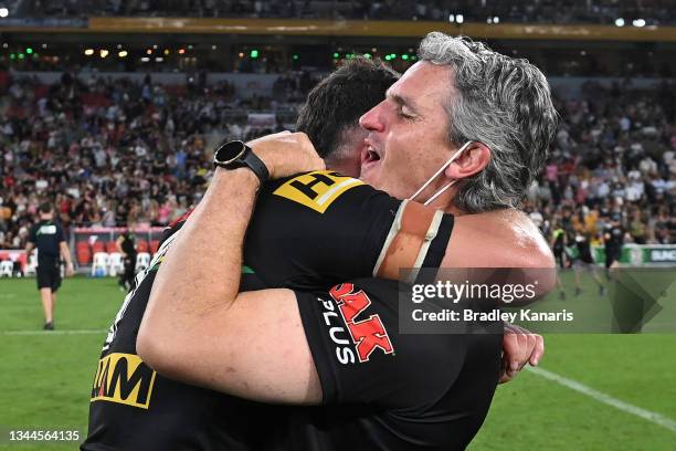 Nathan Cleary of the Panthers hugs his father and coach Ivan Cleary after winning the 2021 NRL Grand Final match between the Penrith Panthers and the...